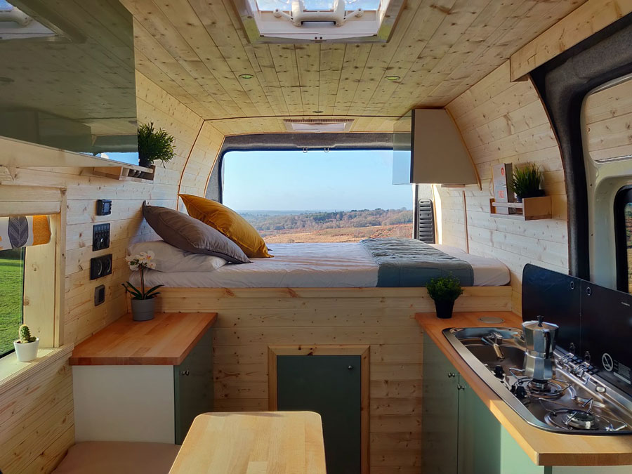 a Scandinavian inspired camper conversion with light wood 