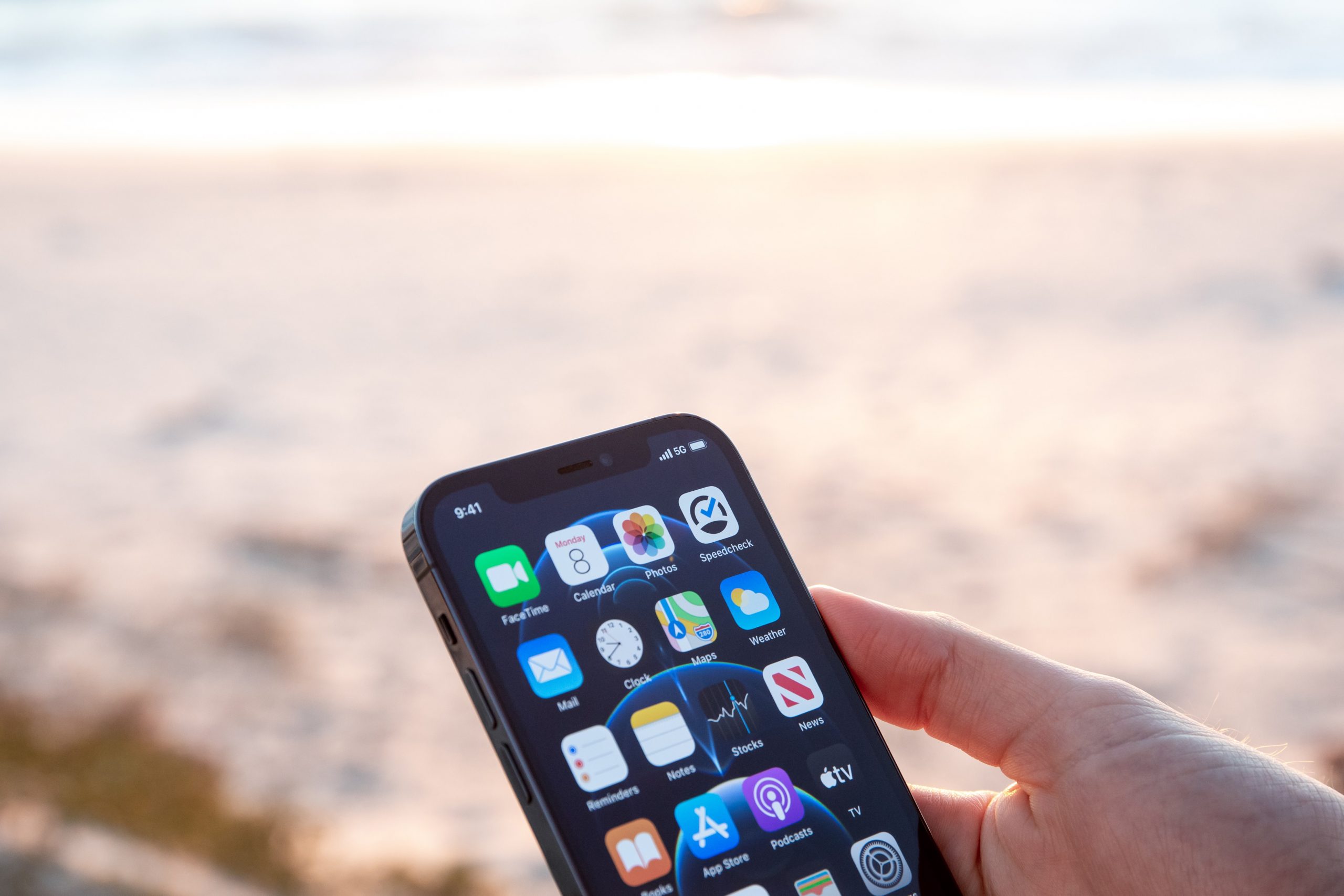 a mobile phone being used at the beach