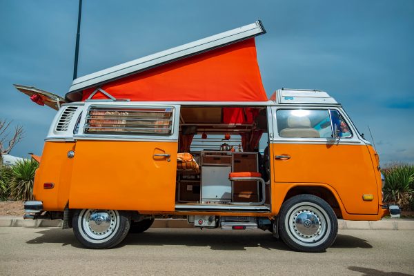 a bright orange VW campervan 