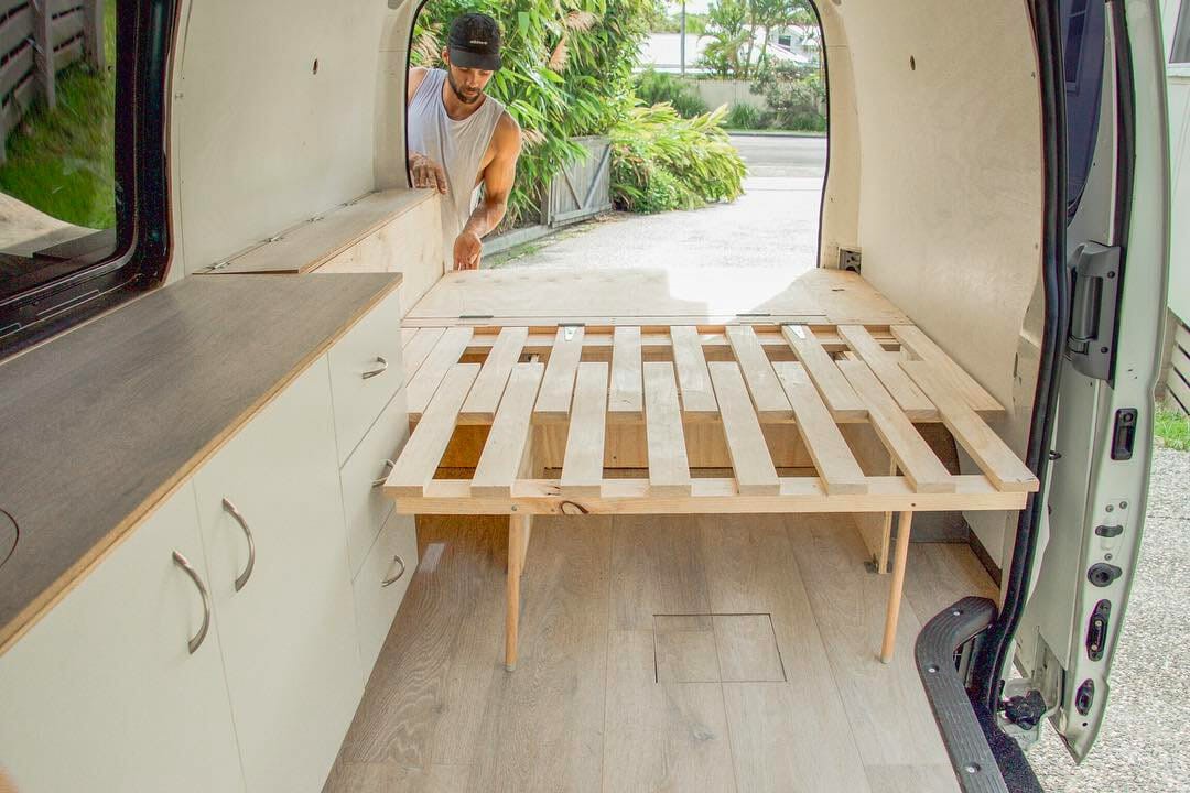 a light wood sliding campervan bed