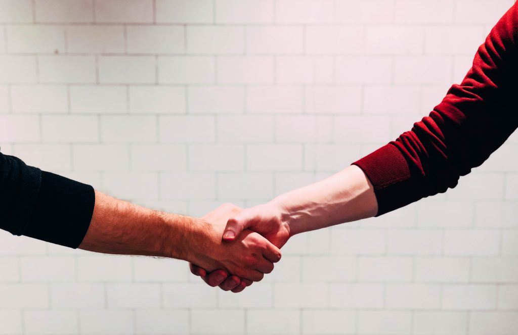 two people shaking hands who agreed a deal on a campervan for sale