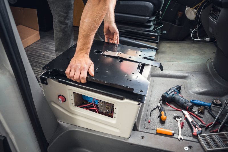 Installing swivel seat base into the campervan interior